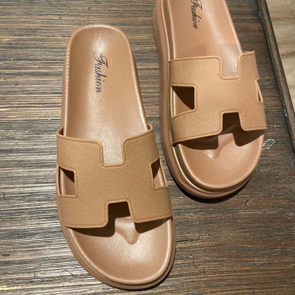 Fashion size 6 (runs small like a 5.5) camel colored sandals. Never worn.